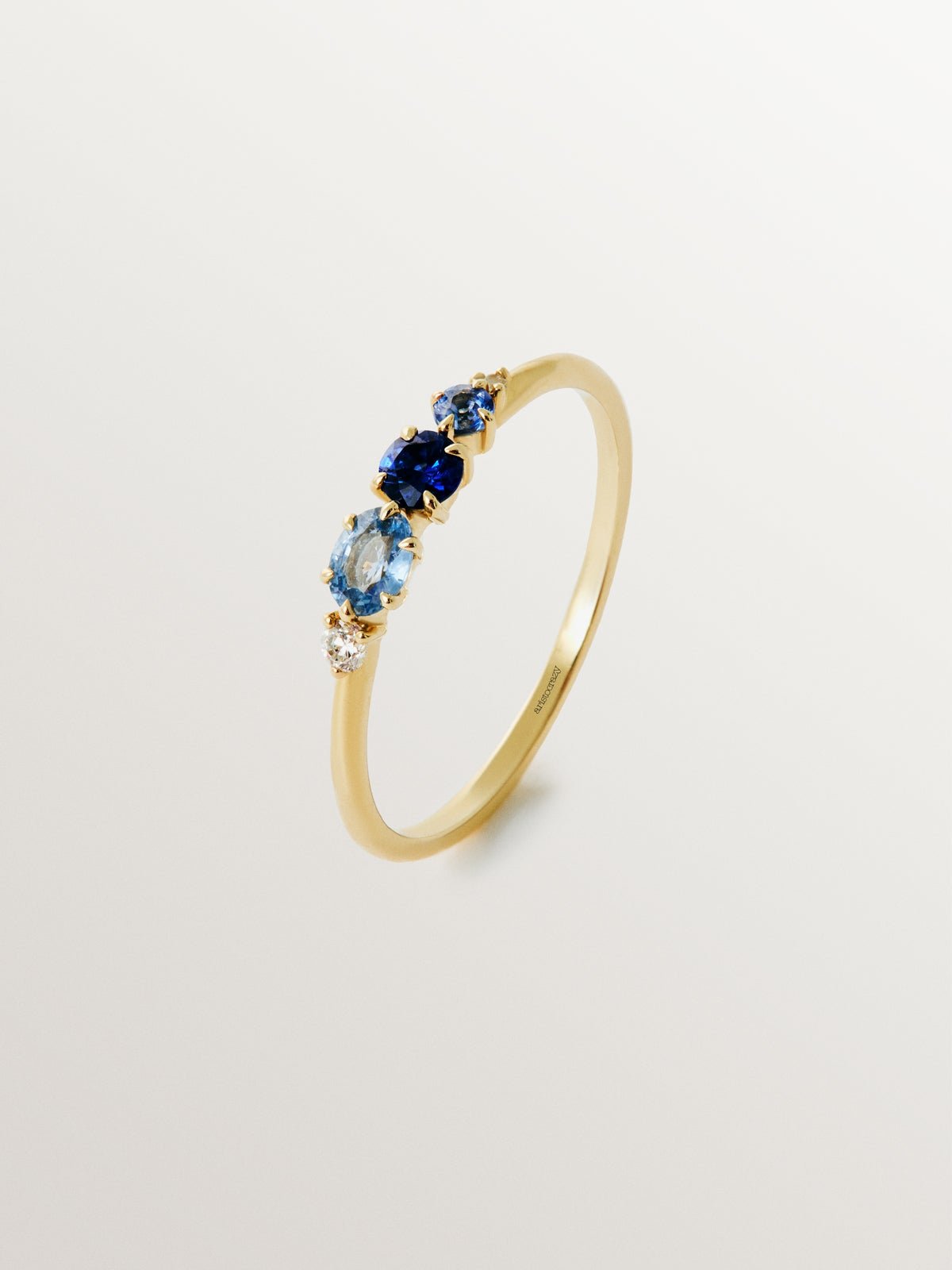 9K yellow gold ring with blue sapphires and diamonds