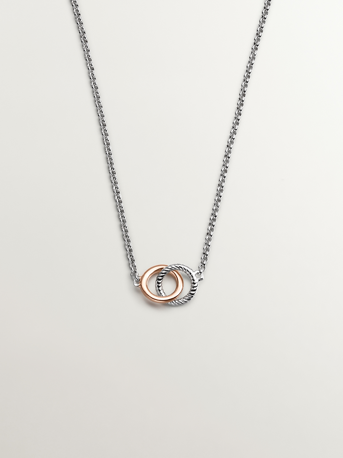 925 Sterling Silver pendant and 925 Sterling Silver pendant coated in 18K rose gold with interlocking circles.