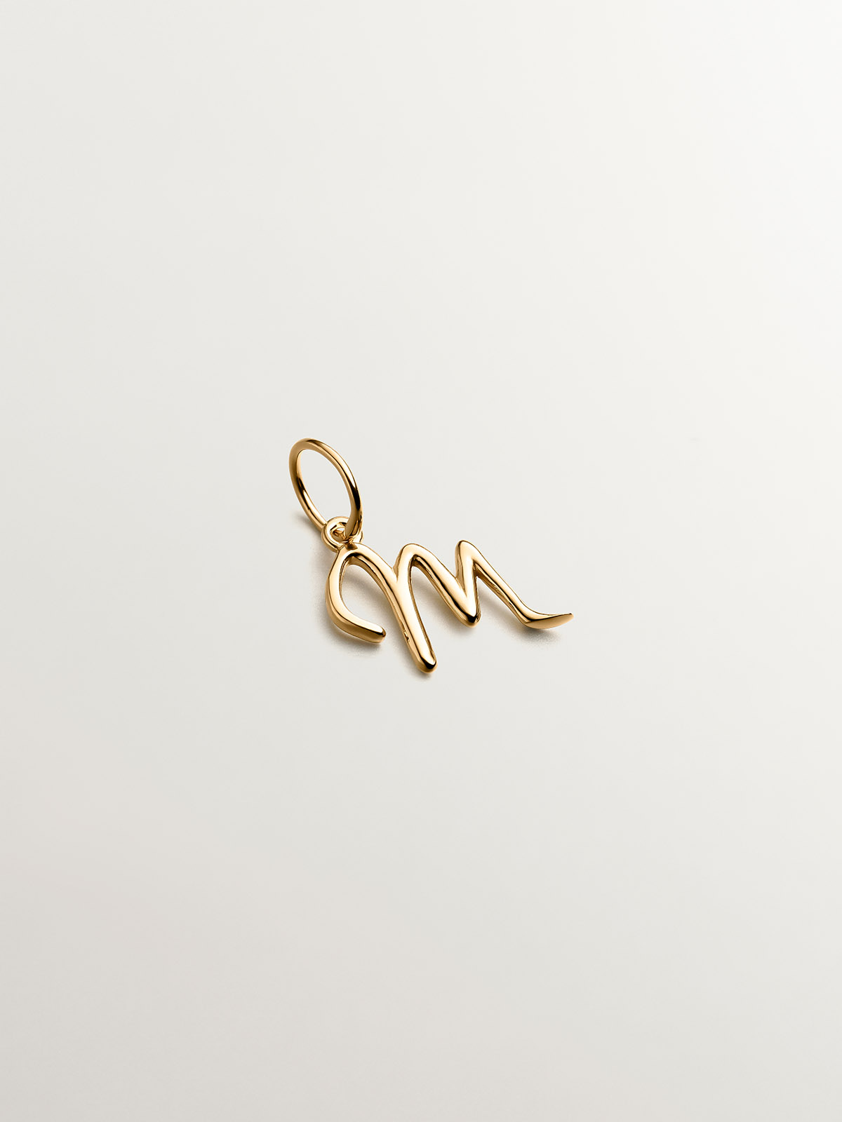 925 Silver charm dipped in 18K yellow gold with initial M.