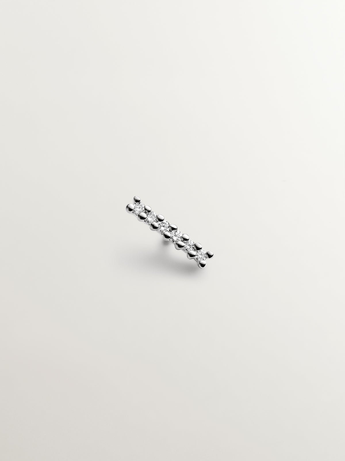 Piercing solitario de oro blanco de 18K con diamantes en talla brillante de 0,02 cts