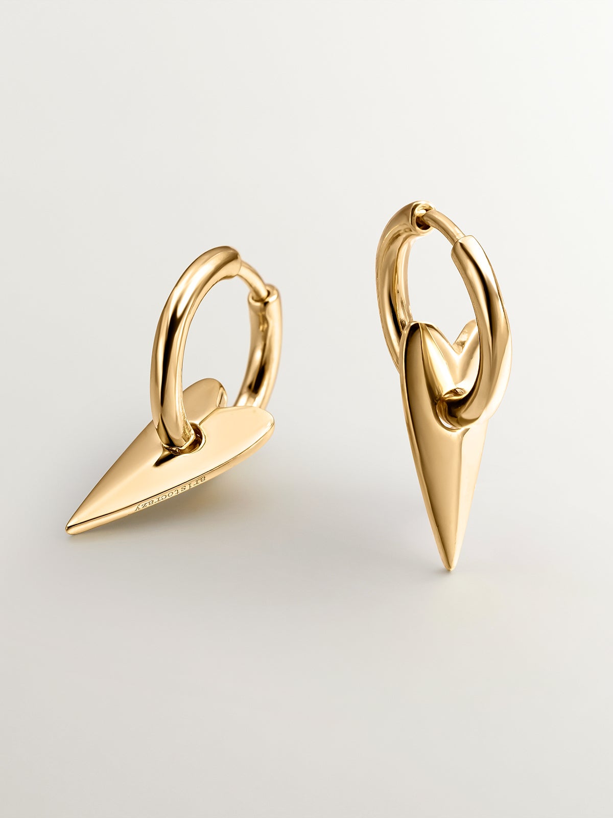 Small hoop earrings made of 925 silver, coated in 18K yellow gold with heart.