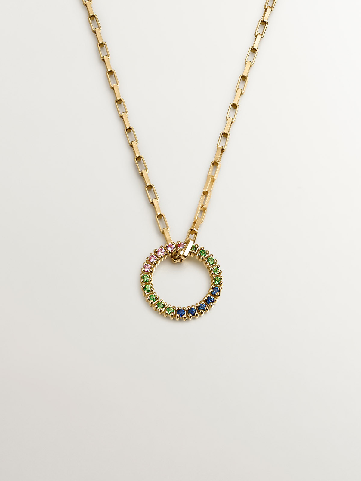925 Silver pendant bathed in 18K yellow gold with tsavorites and multicolor sapphires.