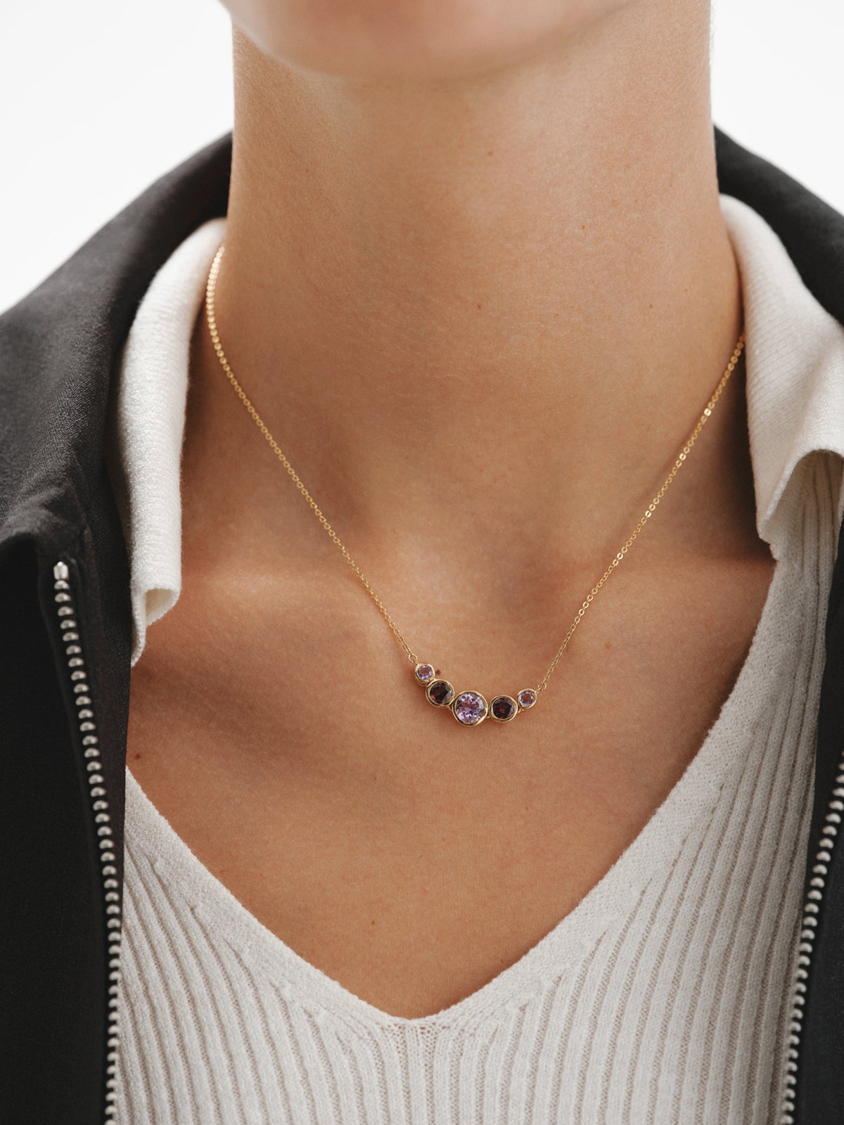 925 Silver pendant bathed in 18K yellow gold with pink rhodolites and purple amethysts.