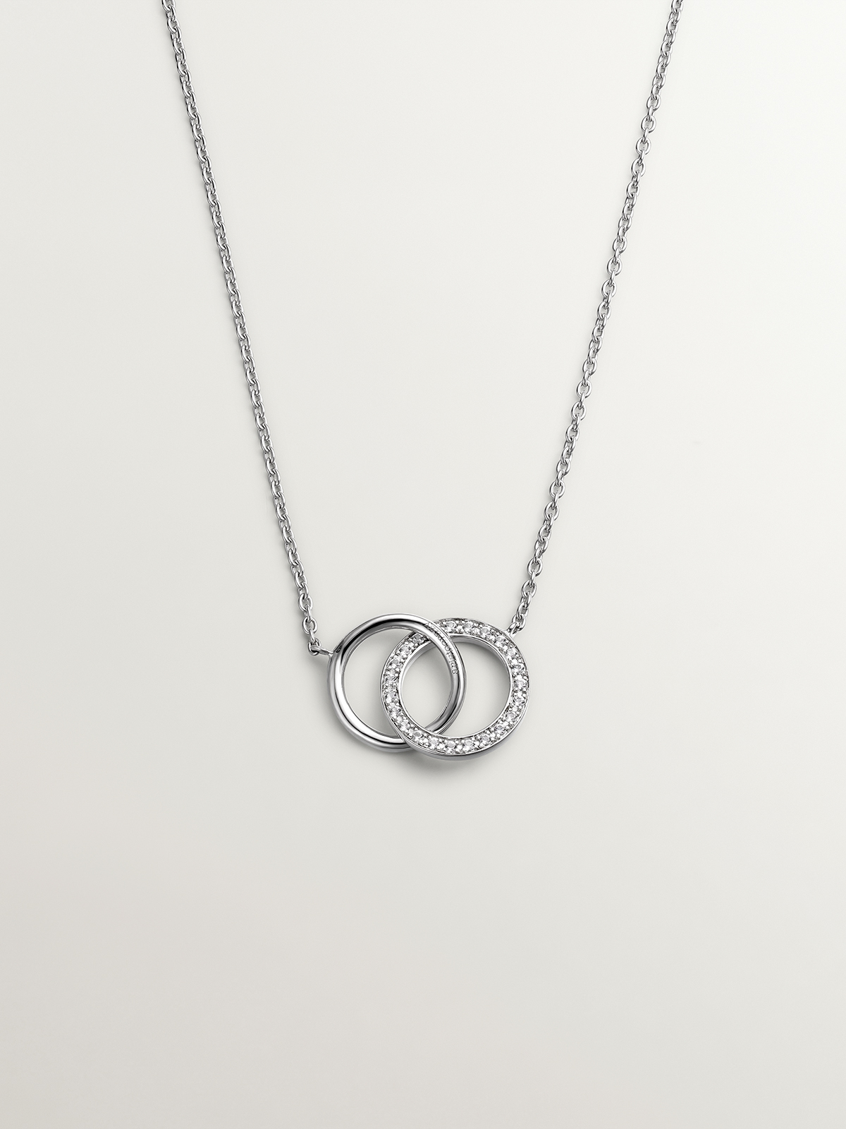 925 Silver pendant with circles and white topaz.