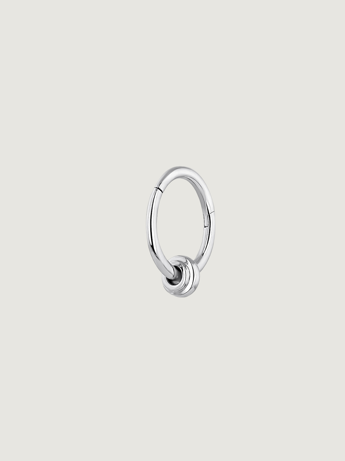 Individual 9K white gold hoop earring with small ball.