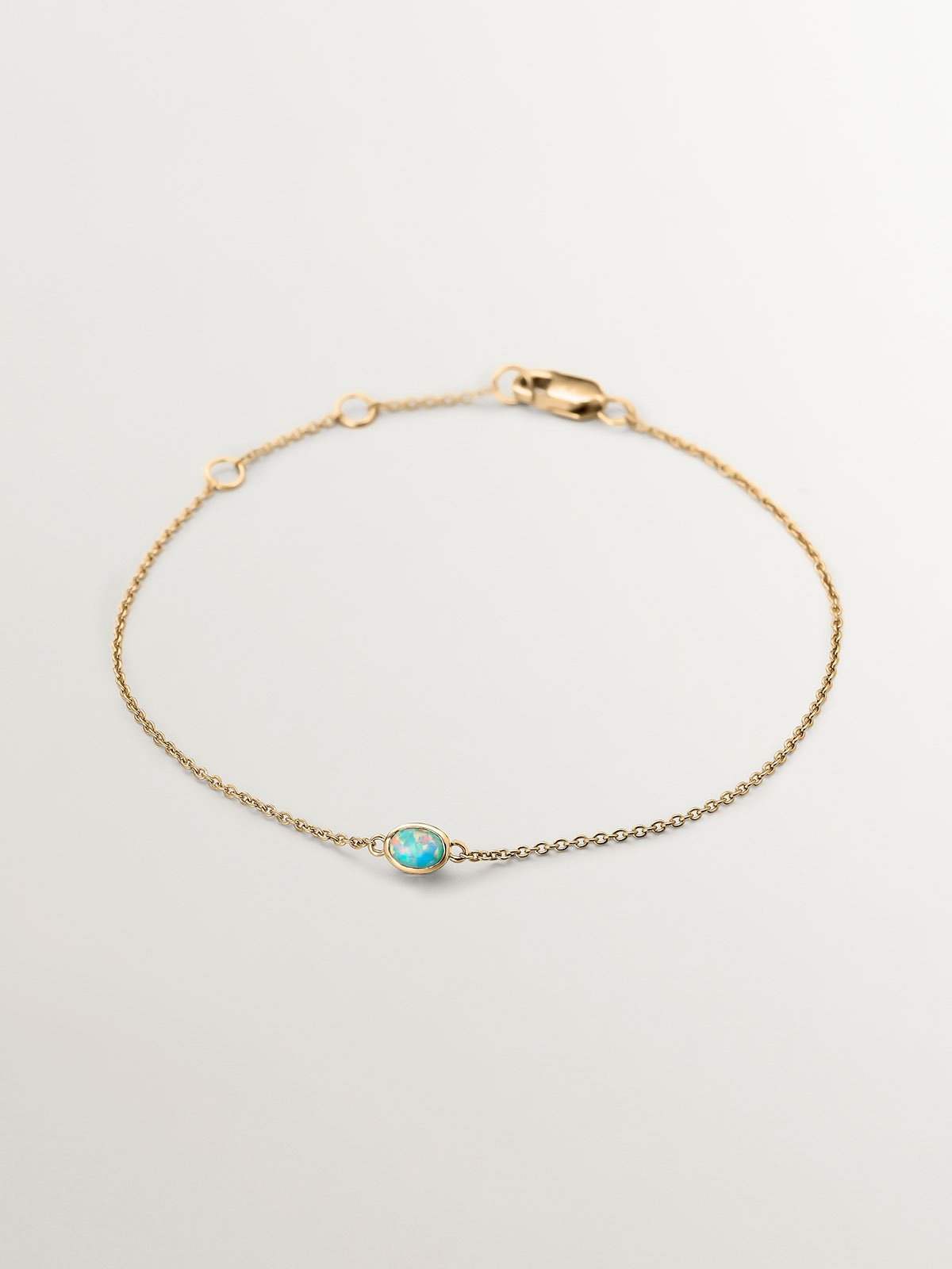 Pulsera de oro amarillo de 18K con ópalos turquesas y diamantes