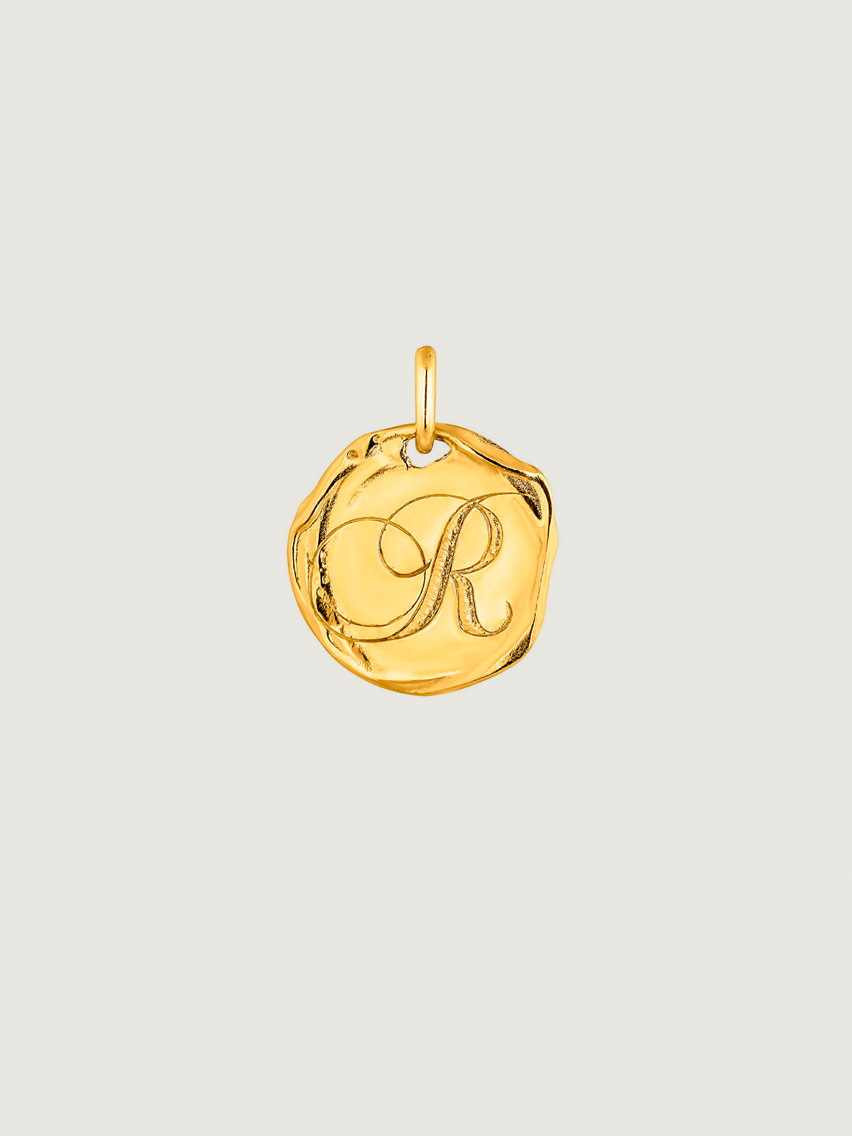 Handcrafted 925 silver charm bathed in 18K yellow gold with initial R.