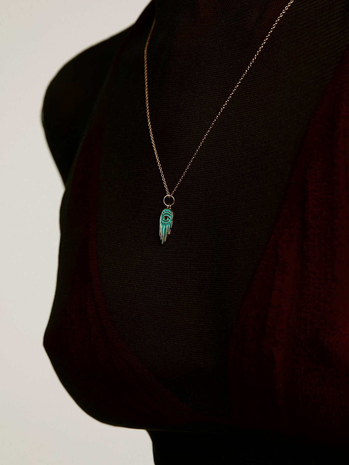 925 Silver charm bathed in 18K yellow gold with turquoise enamel and Hand of Fatima.