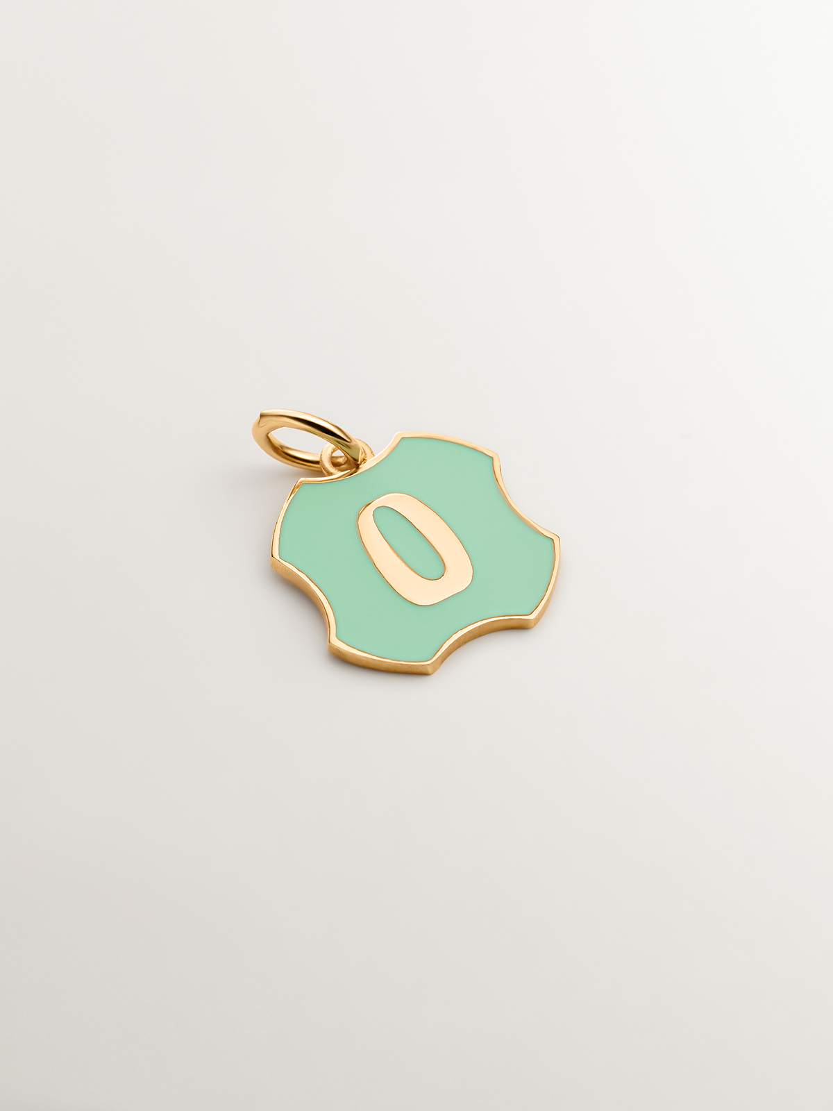 Charm in 925 sterling silver plated in 18K yellow gold with initial O and green enamel with irregular shape
