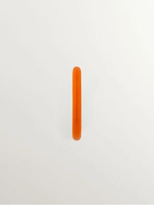 Individual medium hoop earring made of 9K yellow gold with orange enamel.