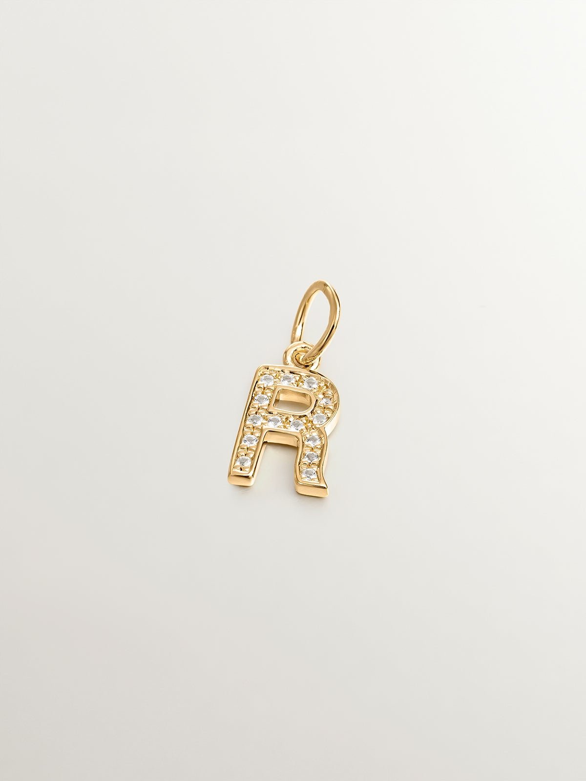 925 Silver charm bathed in 18K yellow gold with white topazes initial R