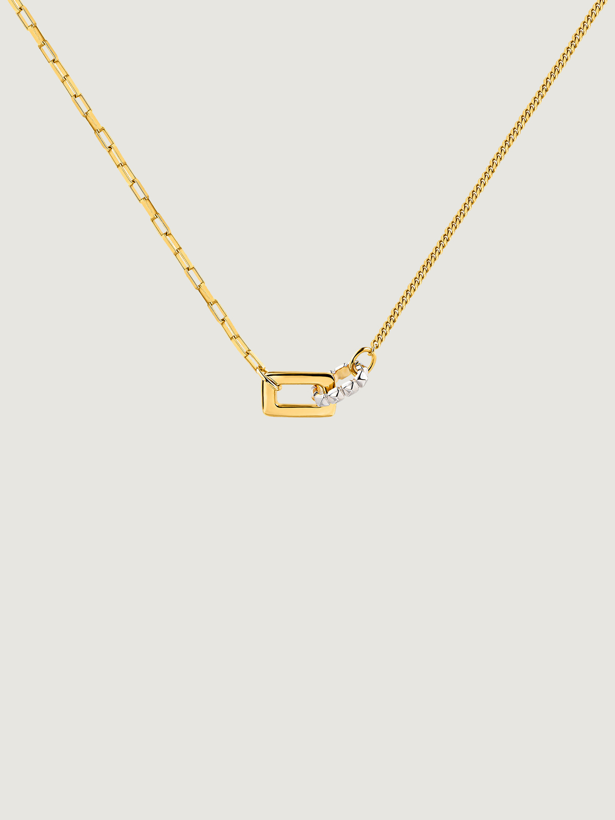 Bicolor pendant of 925 silver and 925 silver bathed in 18K yellow gold with geometric shapes.