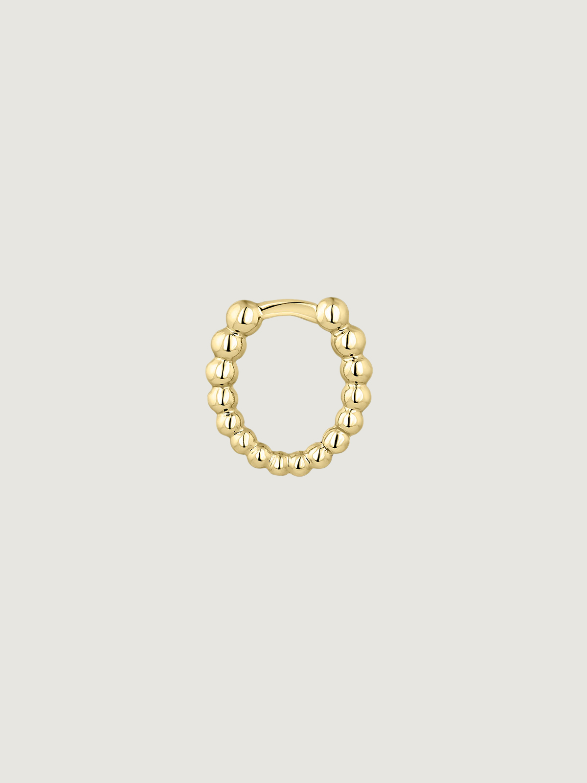 Small individual 9K yellow gold hoop earring with tiny balls.
