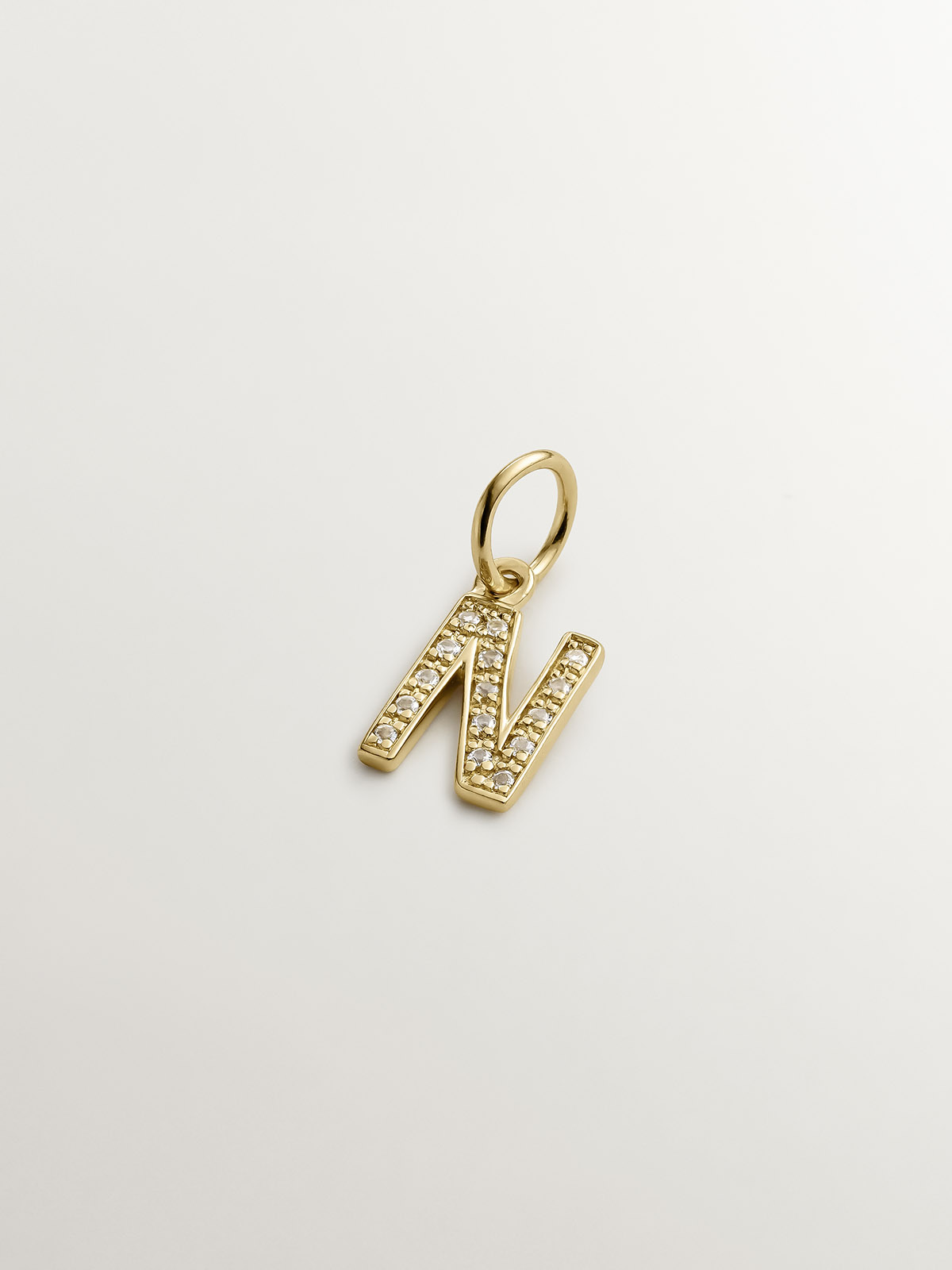 925 Silver charm bathed in 18K yellow gold and white topaz initial N