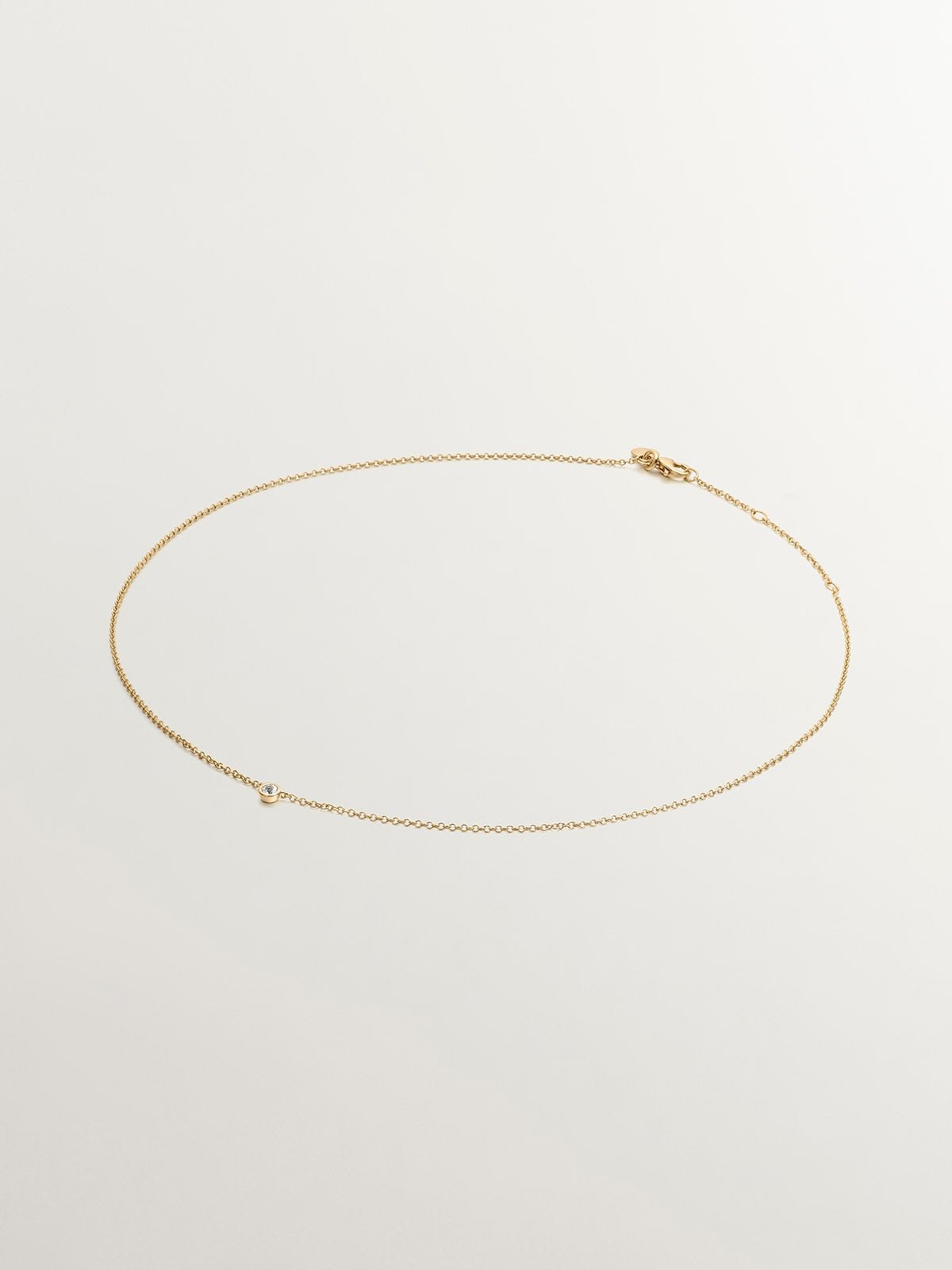 Colgante solitario de plata 925 bañada en oro amarillo de 18K con topacio blanco