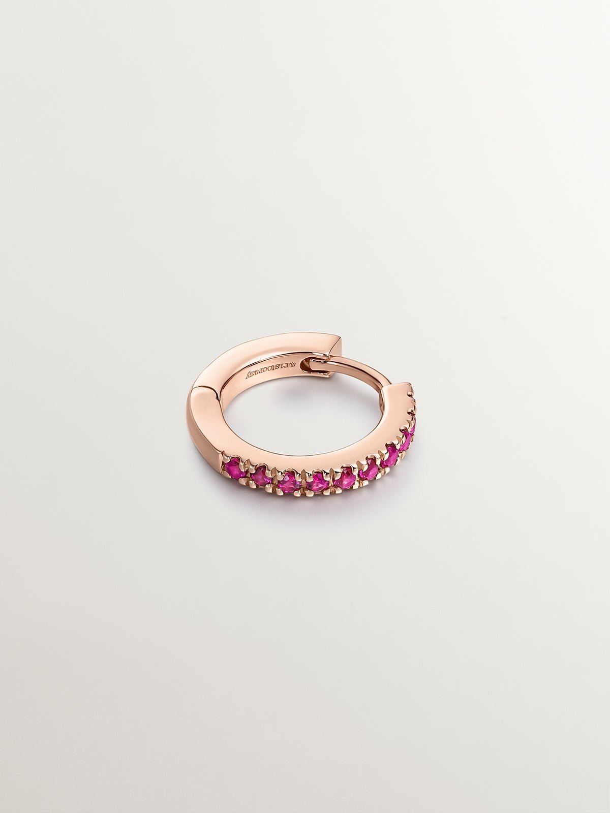 Individual 9K rose gold hoop earring with rubies