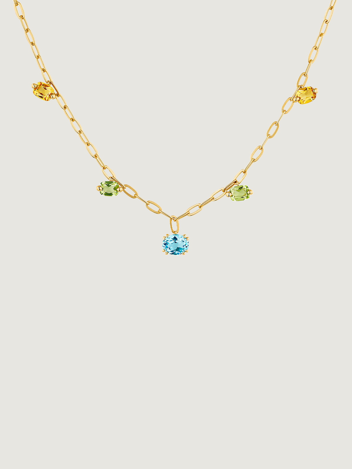 925 Silver necklace bathed in 18K yellow gold with Swiss blue topazes, green peridots and citrines.