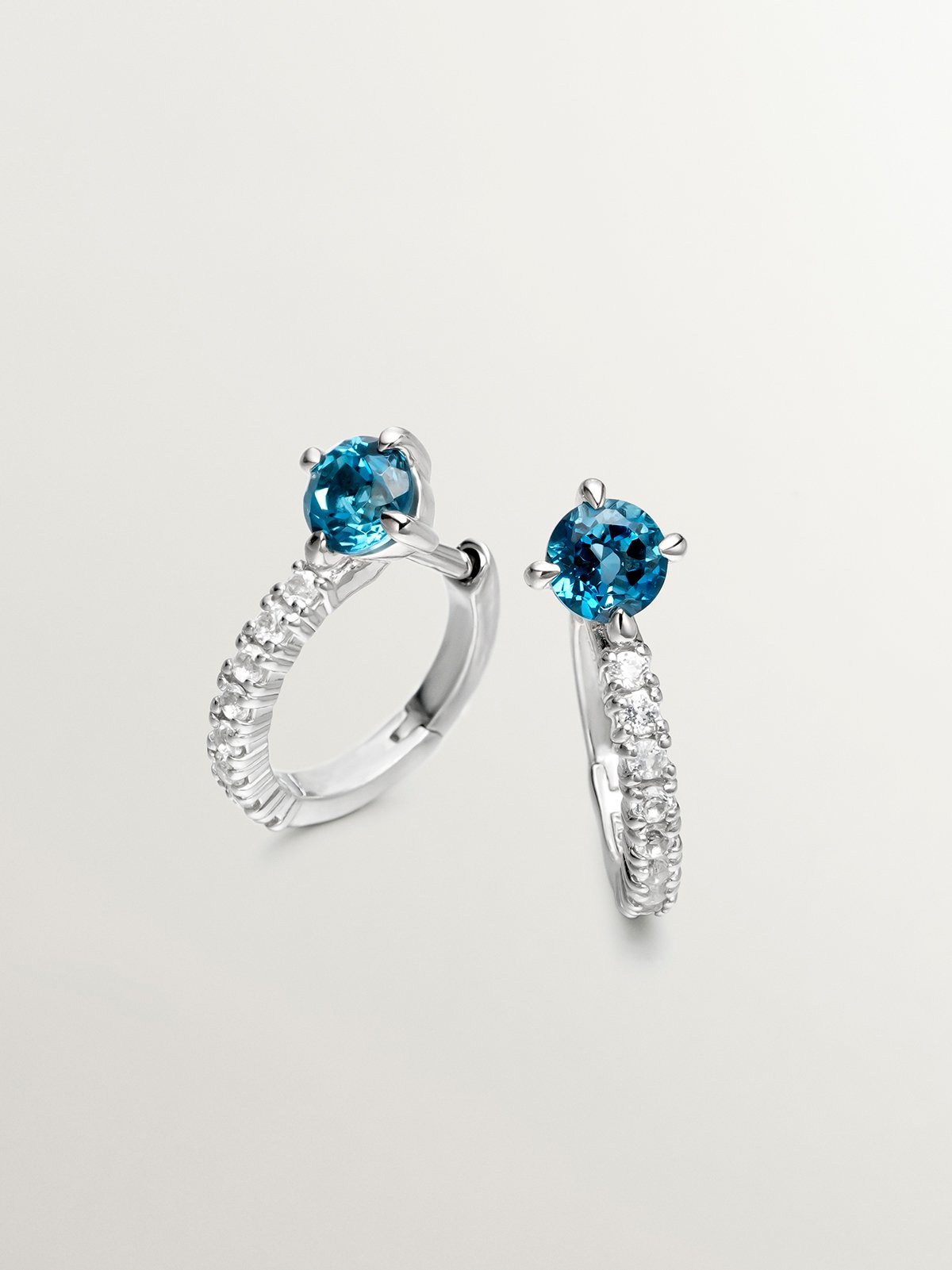 925 Silver hoop earrings with blue and white topaz.