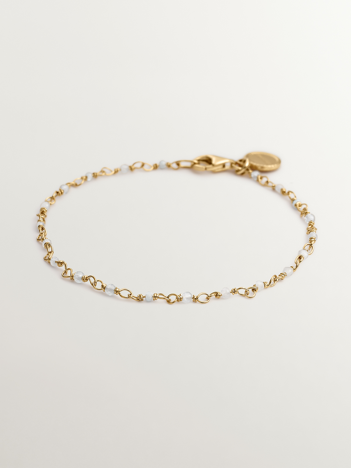Pulsera de plata 925 bañada en oro amarillo de 18K con bolitas de aguamarina