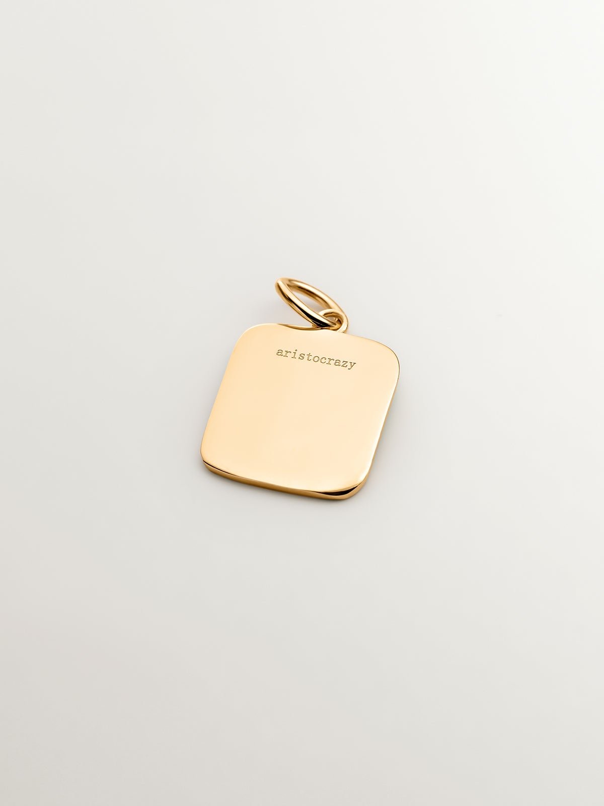 Charm de plata 925 bañada en oro amarillo de 18K con inicial H y esmalte turquesa con forma cuadrada