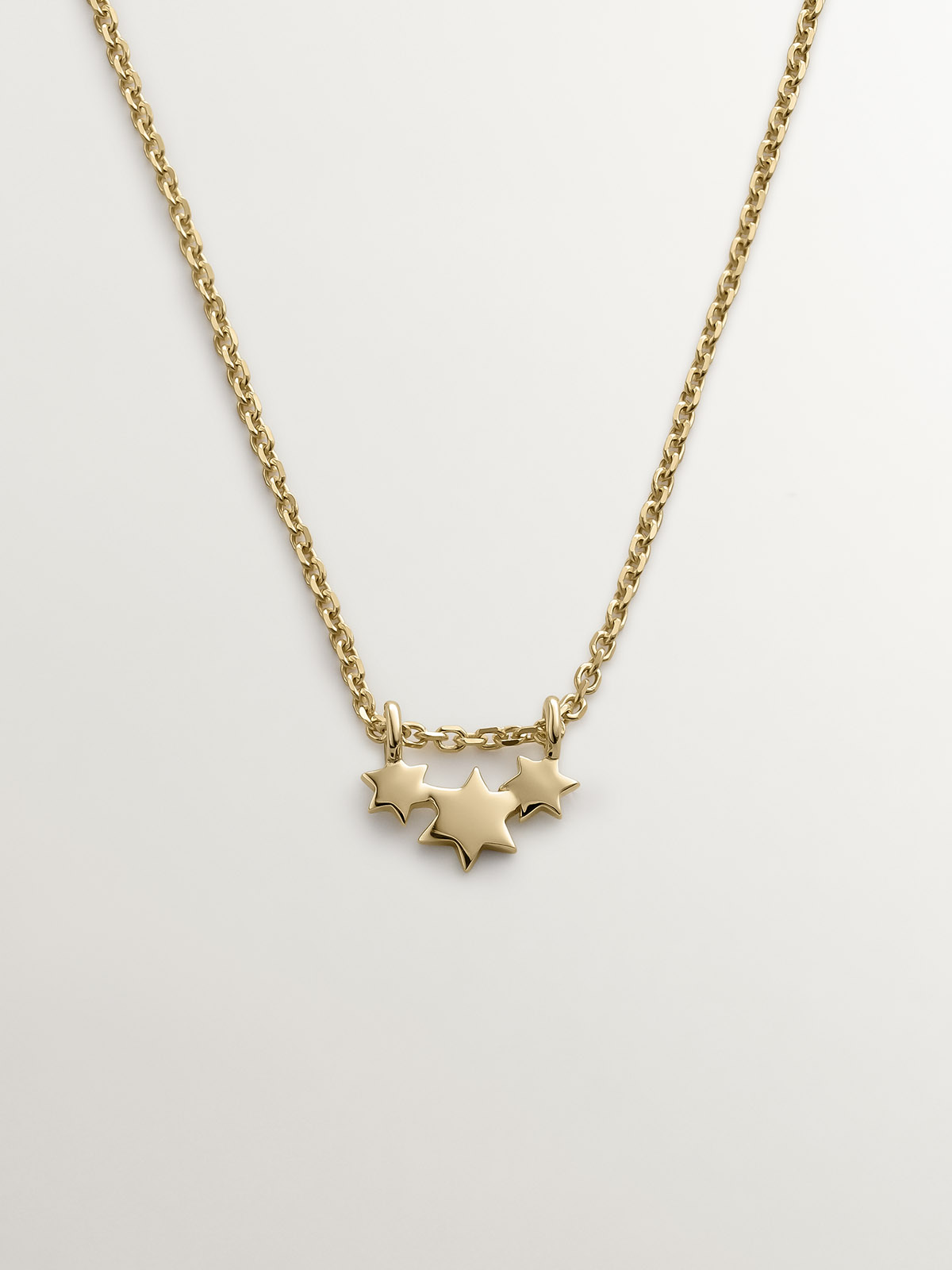 Colgante de oro amarillo de 9K con estrellas