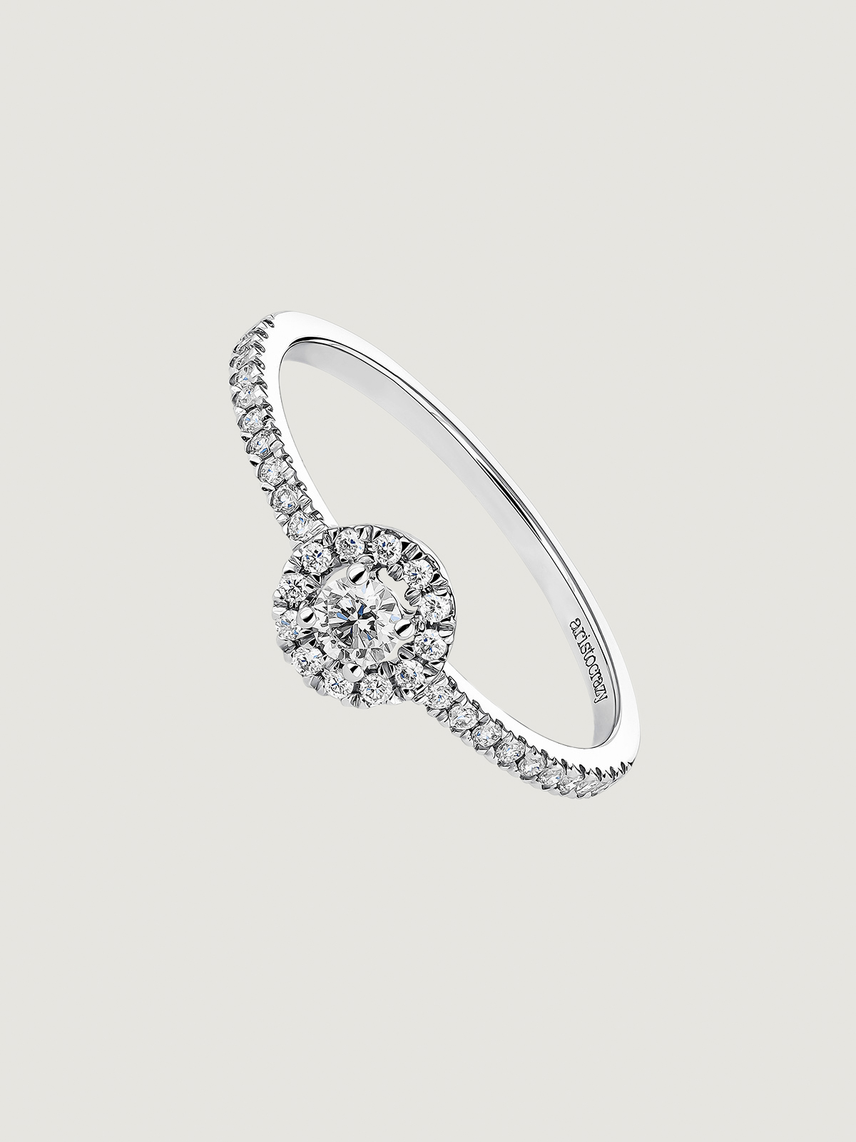 18K white gold ring with diamonds on the band and rosette.