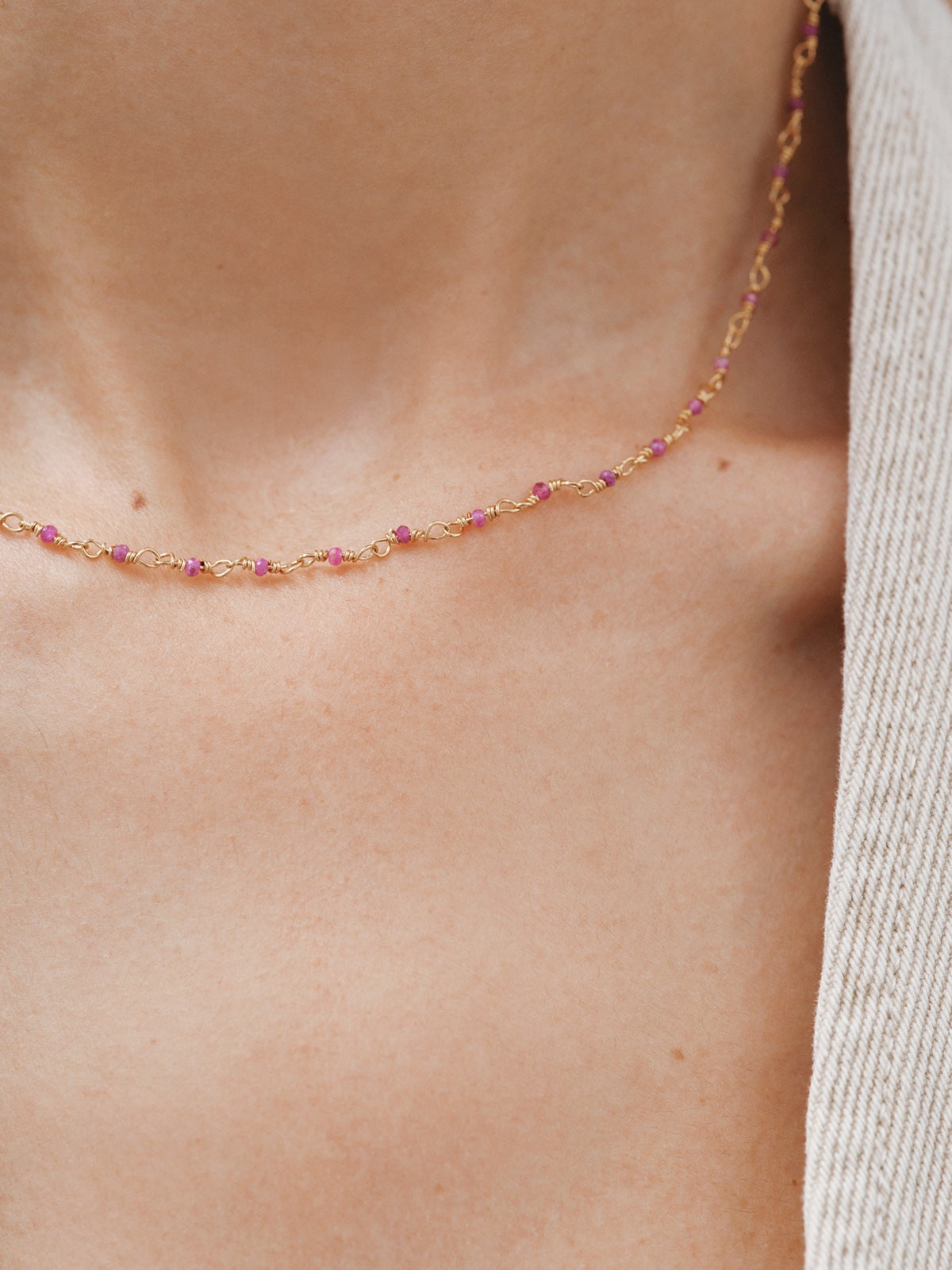 925 Silver chain bathed in 18K yellow gold with pink ruby beads.