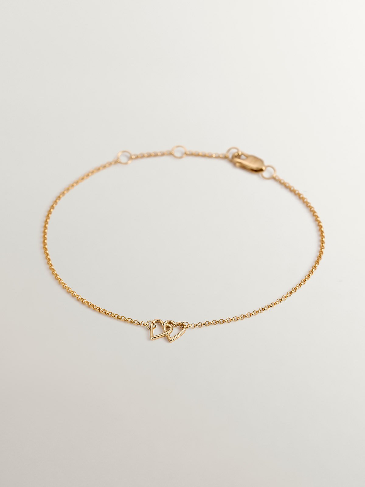 9K Yellow Gold bracelet with interlaced hearts