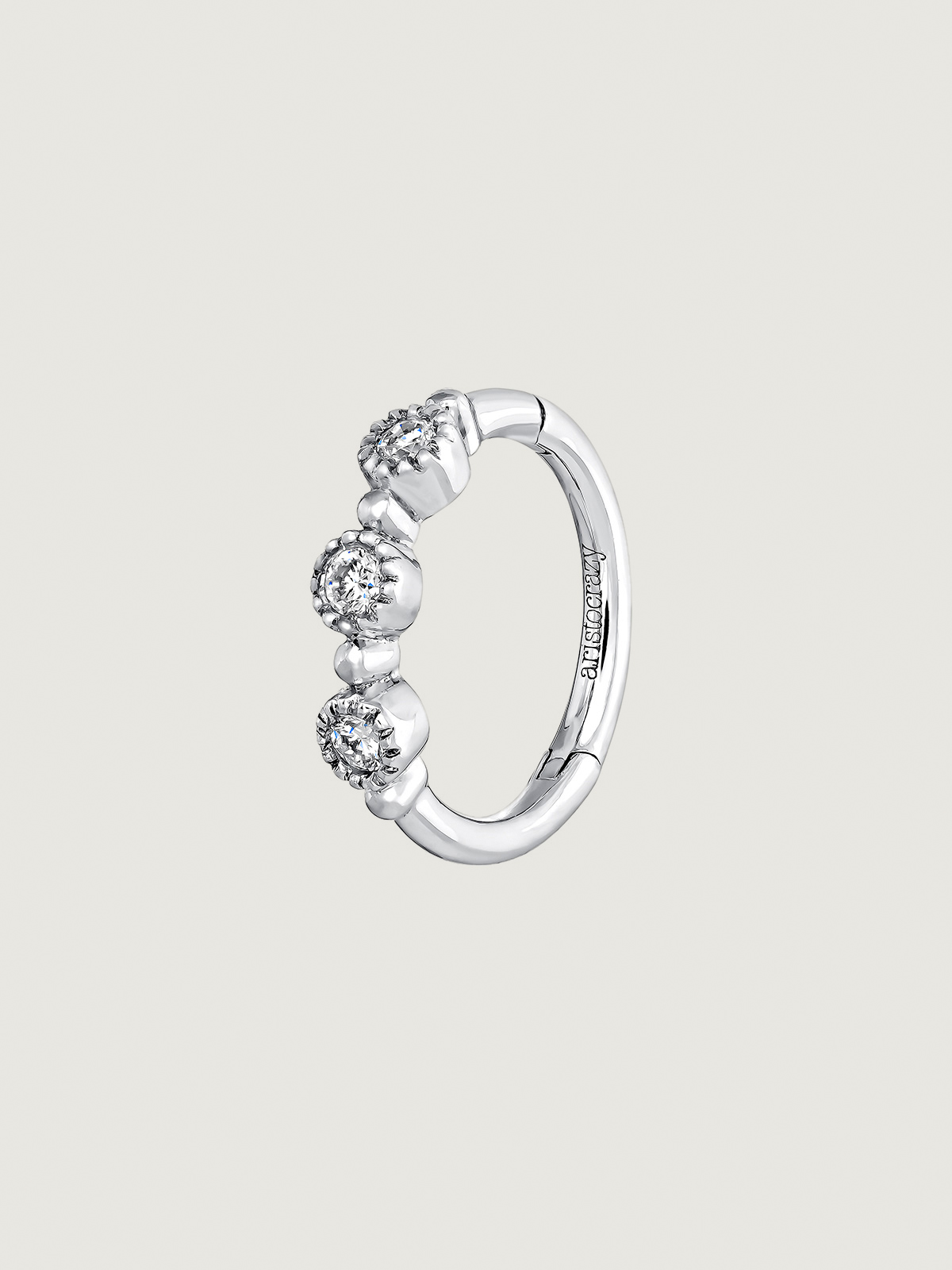 Individual 9K white gold hoop earring with 0.042 cts diamonds.