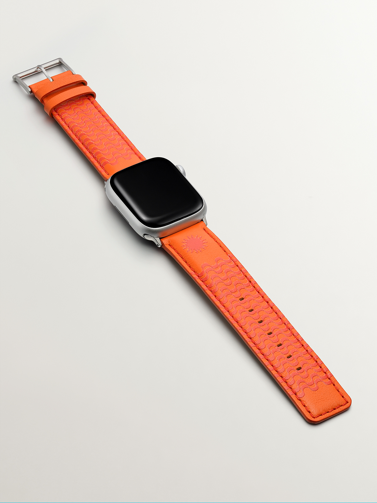 Correa para Apple Watch de cuero naranja con estampado de soles