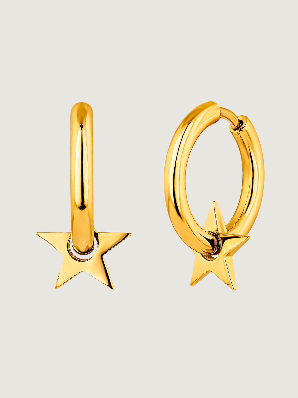 Small hoop earrings made of 925 silver, bathed in 18K gold with a star.