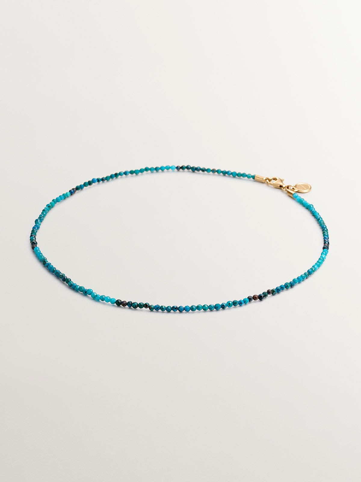 925 Silver necklace bathed in 18K yellow gold with chrysocolla beads.