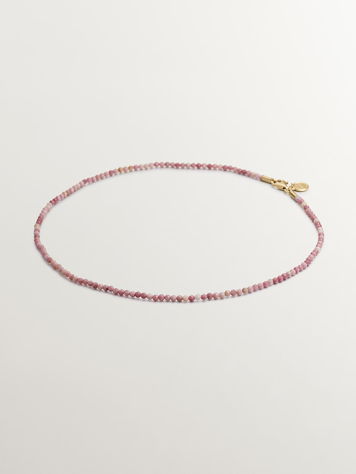 925 silver necklace bathed in 18K yellow gold with pink rhodonite beads.