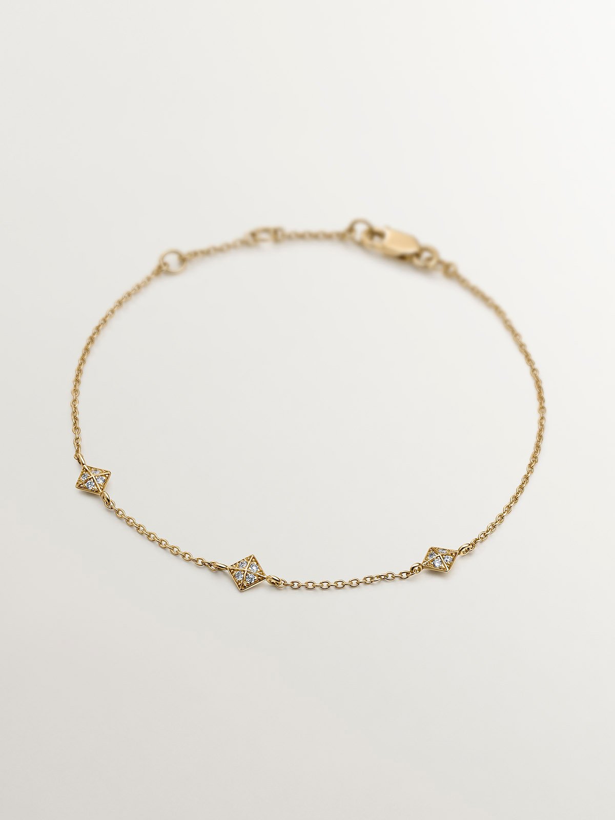 18K yellow gold bracelet with geometric shapes and diamonds