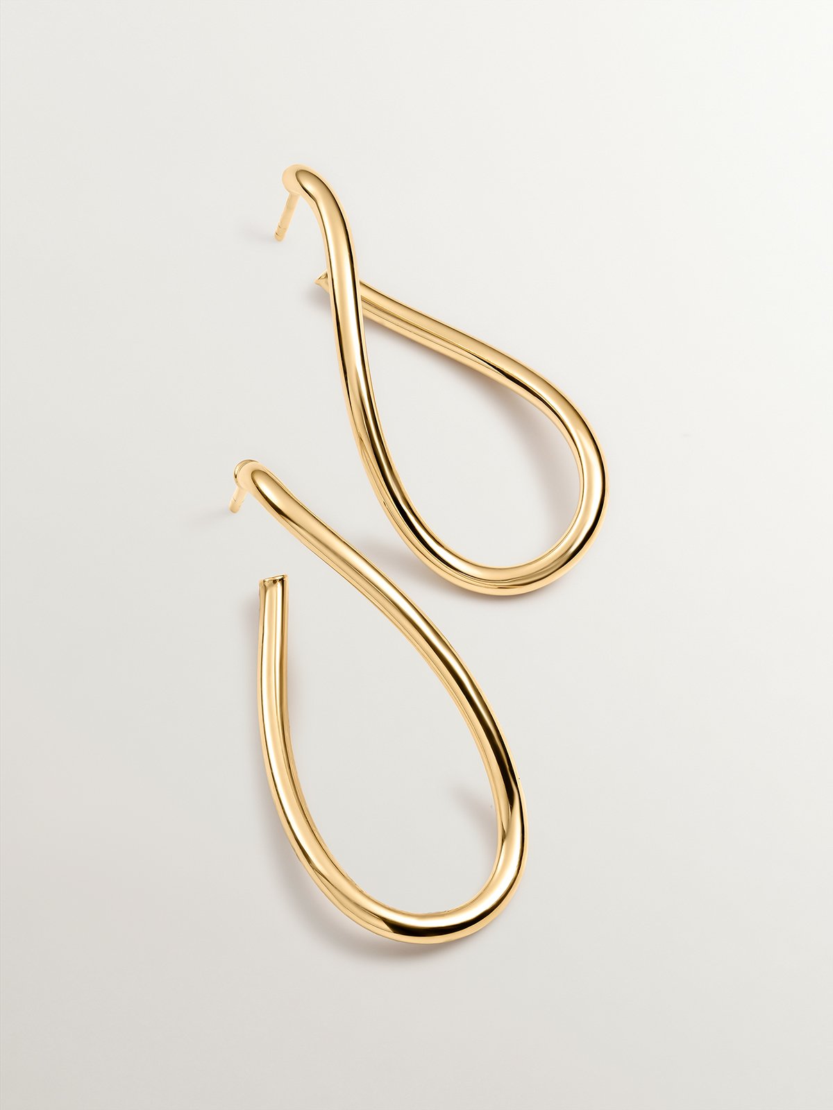 Large wavy hoop earrings made of 925 silver plated in 18K yellow gold