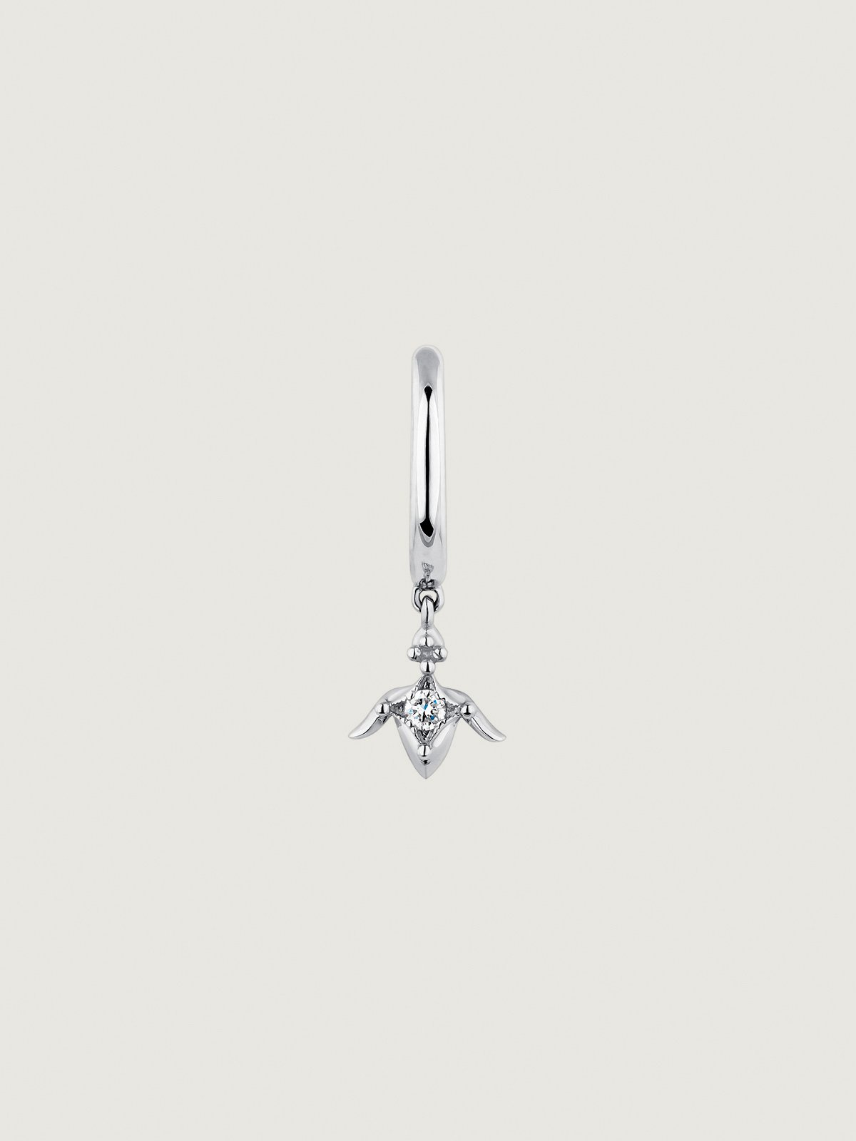 Individual small hoop earring in 9K white gold with diamond and lotus flower.