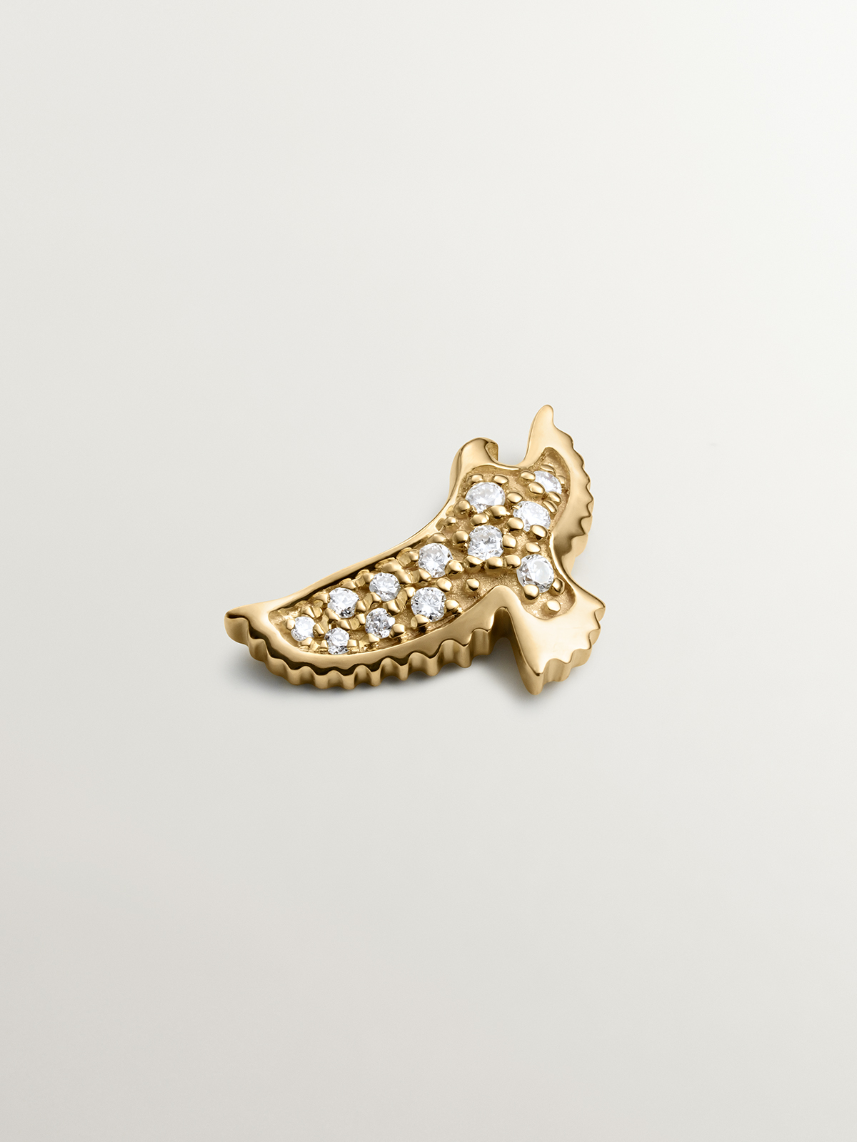 Individual 18K yellow gold earring with eagle shape and diamonds.