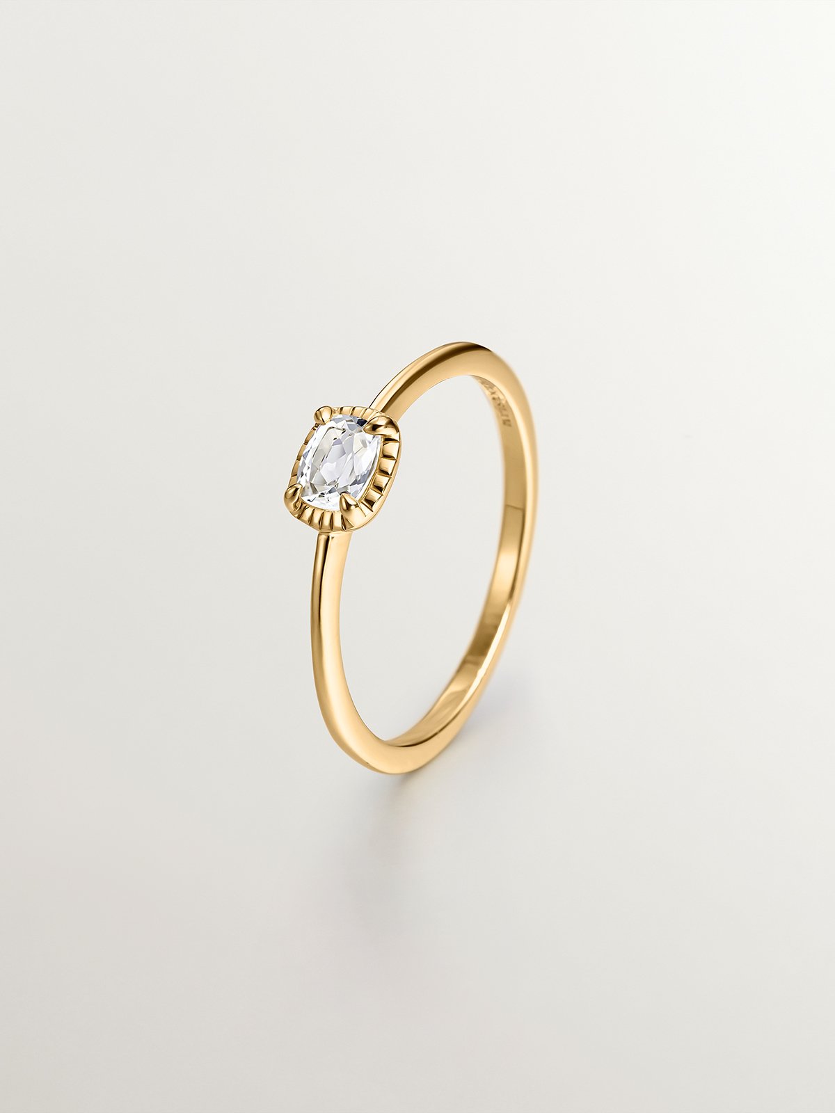 925 Silver ring bathed in 18K yellow gold with white topaz.