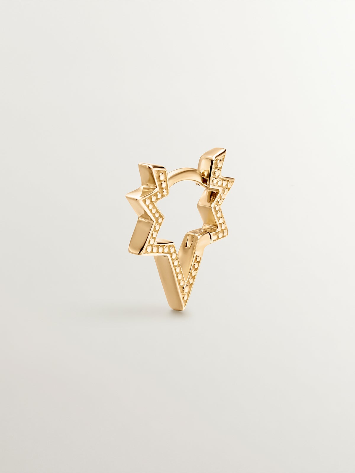 9K yellow gold single earring in the shape of a star.