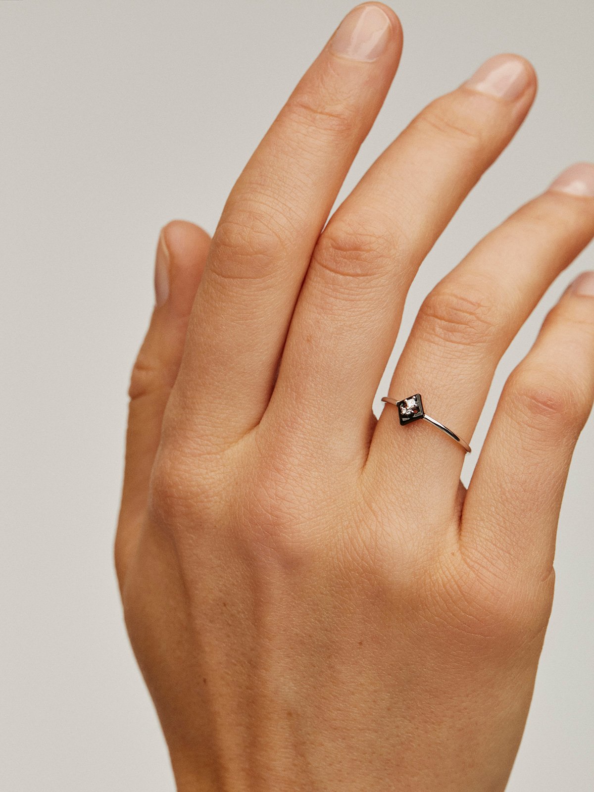 18K white gold ring with diamonds and black enamel.