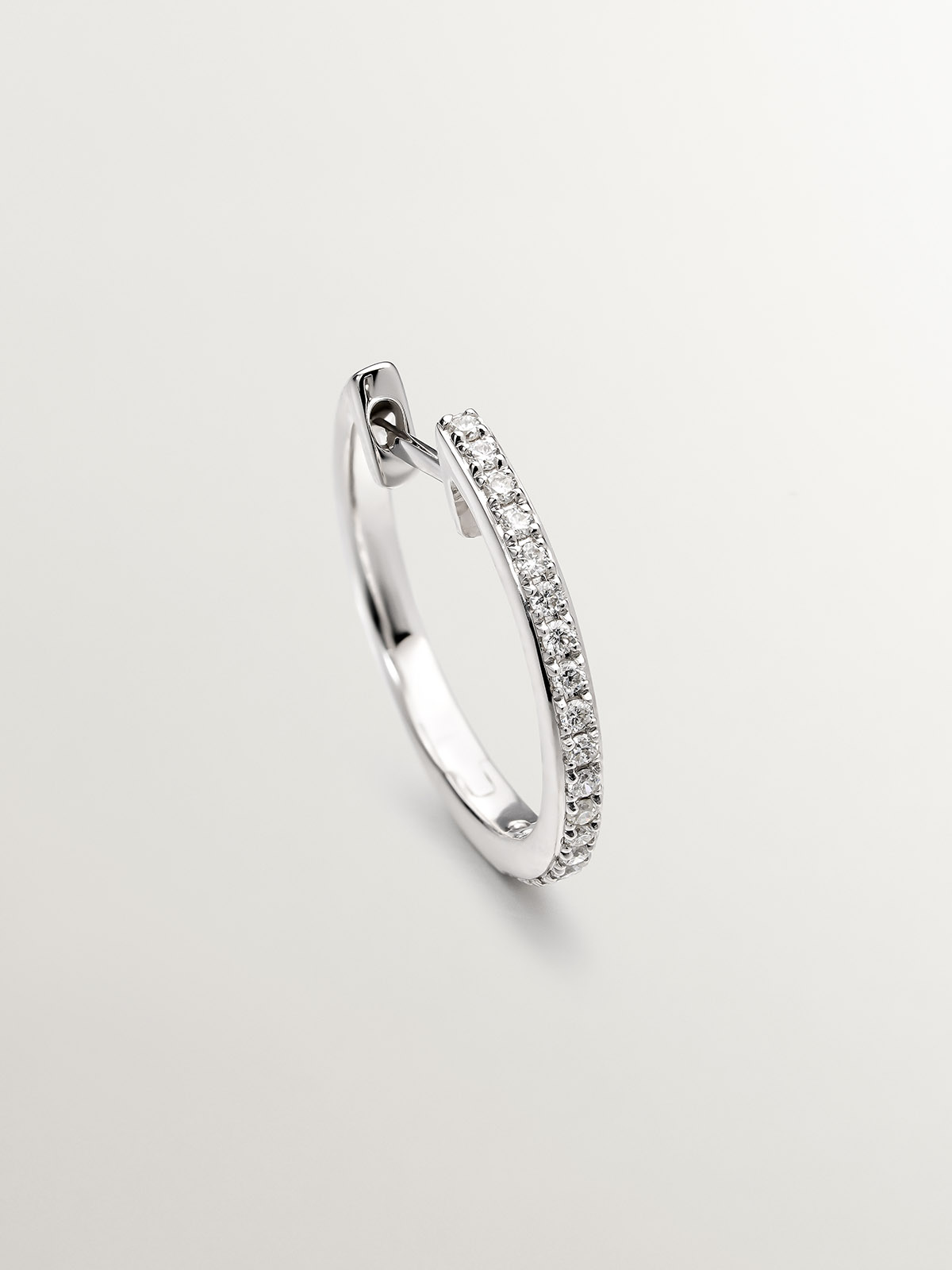 18K white gold small hoop earring with diamonds.