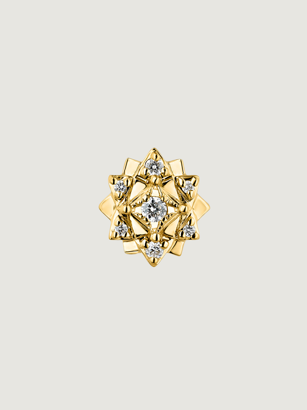 Individual 9K yellow gold earring with diamonds and flower.