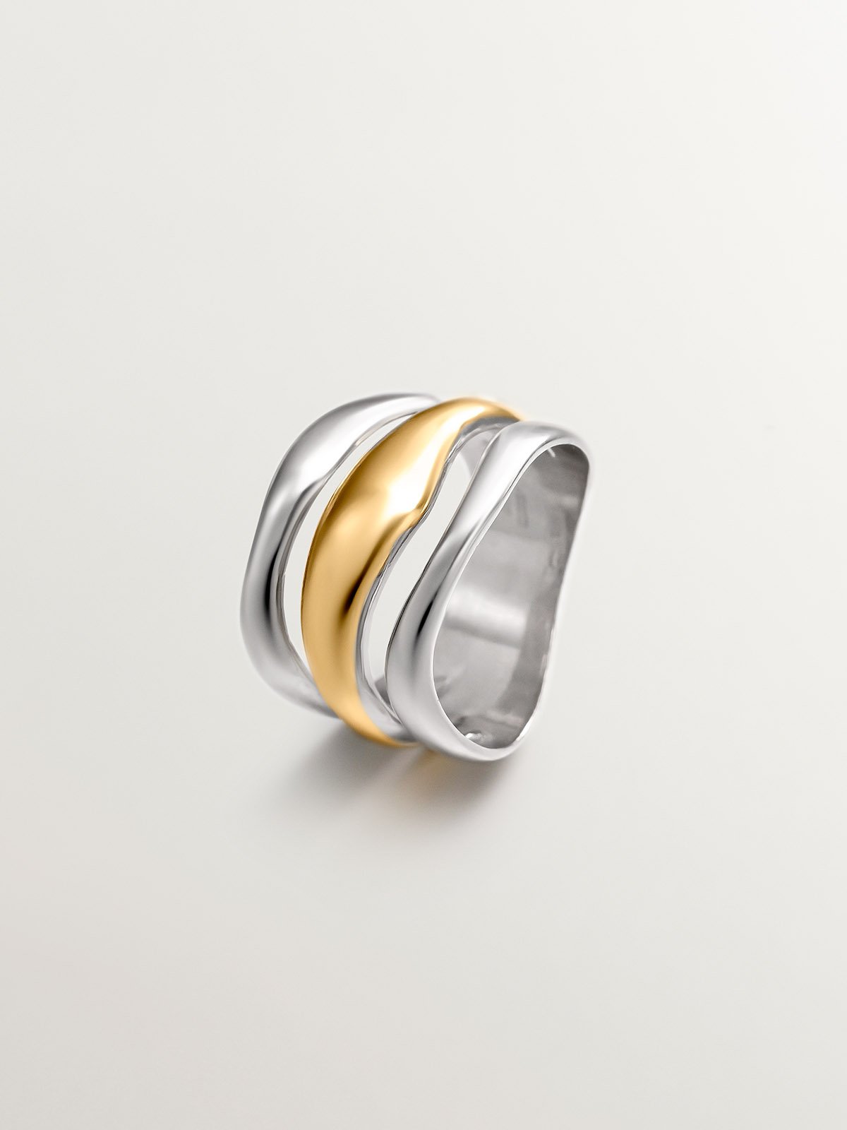 Bicolor triple ring made of 925 silver and 925 silver bathed in 18K yellow gold.