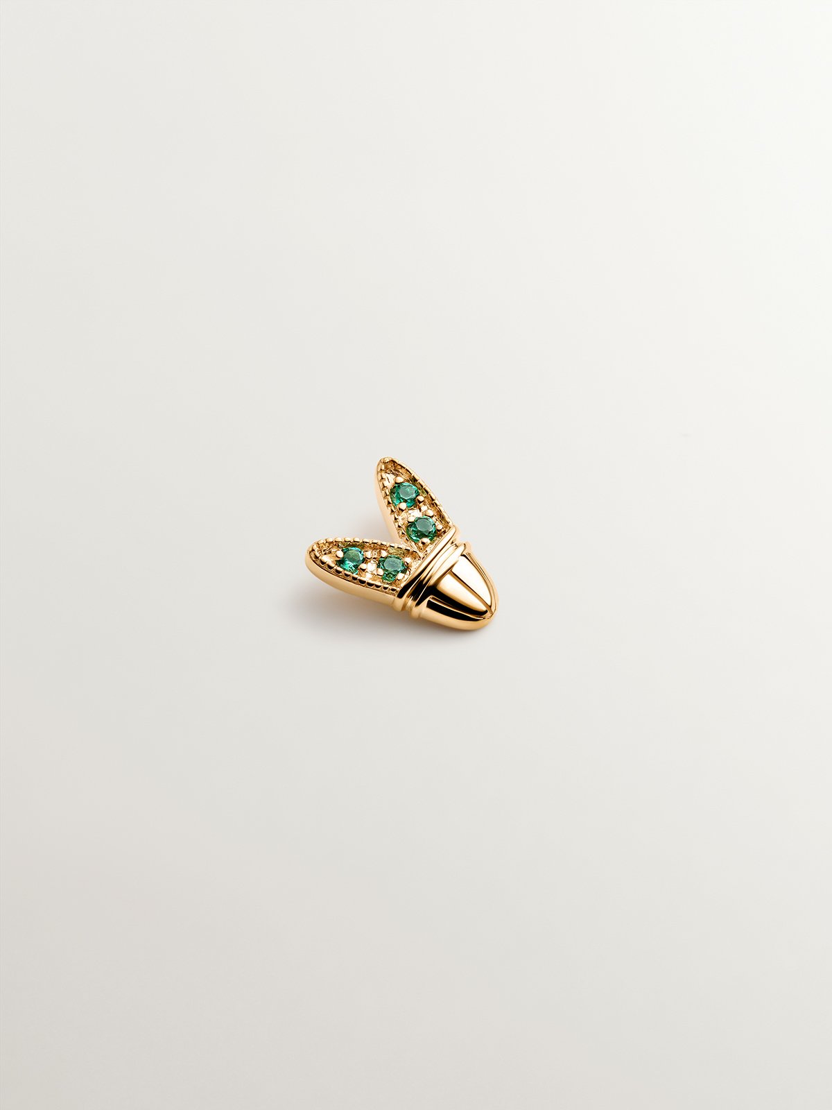 18K yellow gold piercing with emeralds and wing shape