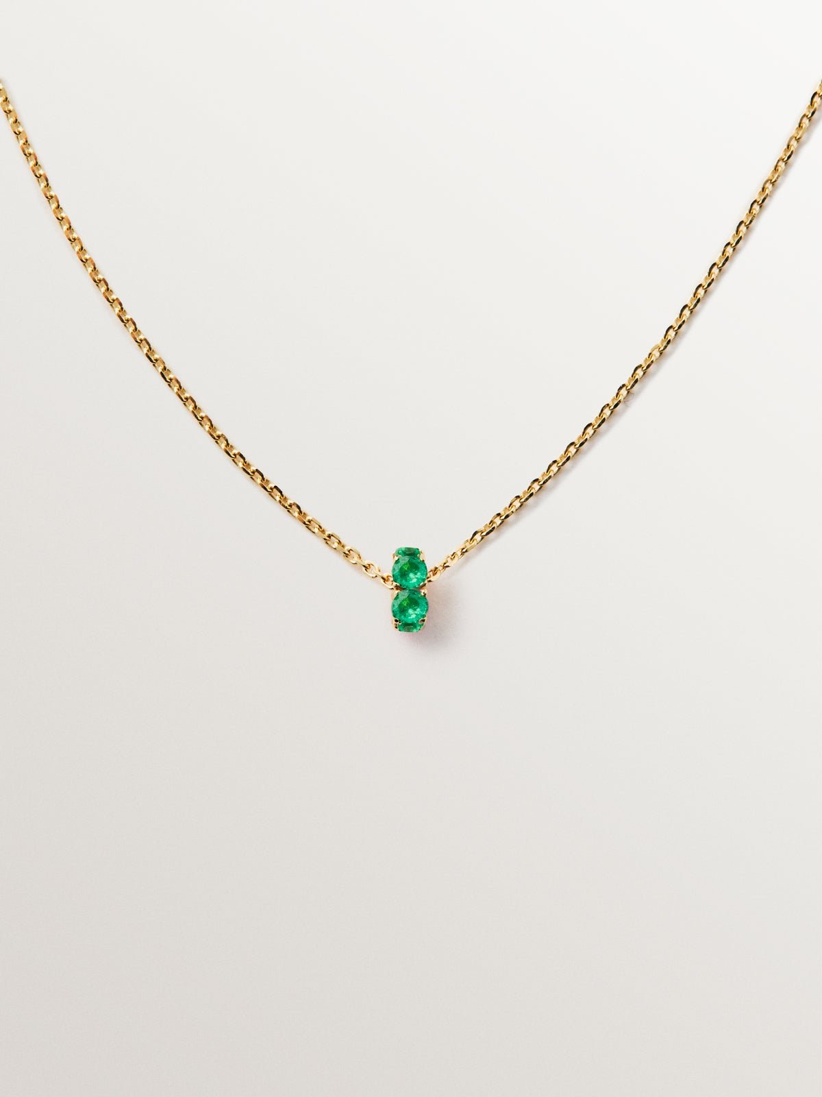 9K yellow gold pendant with emeralds and diamonds