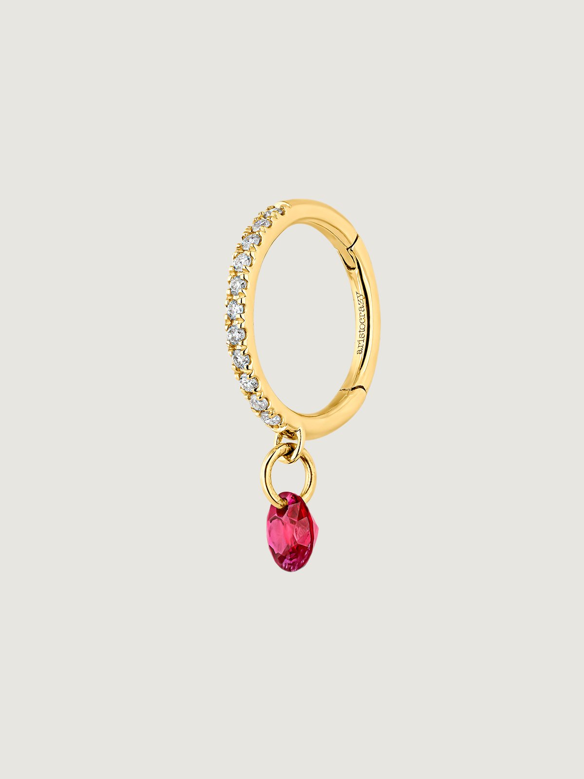 Individual 18K yellow gold hoop earring with ruby and diamonds.