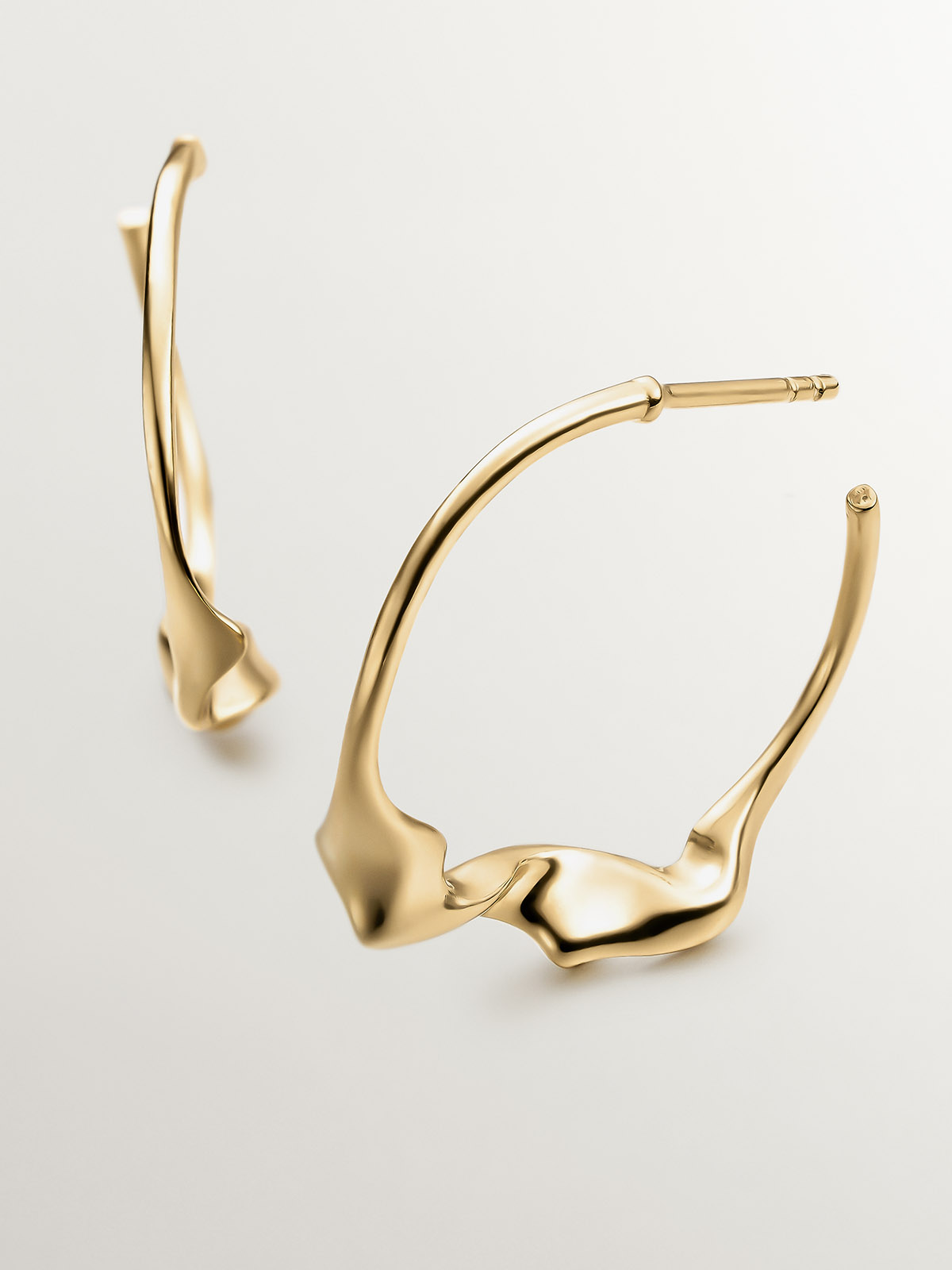 Large irregular hoop earrings made of 925 silver covered in 18K yellow gold