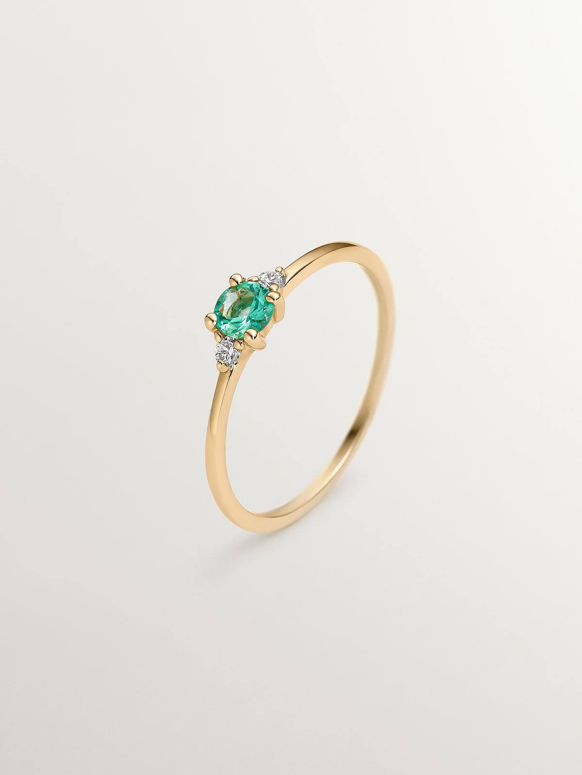 9K Yellow Gold Trilogy Ring with Emerald and Diamonds