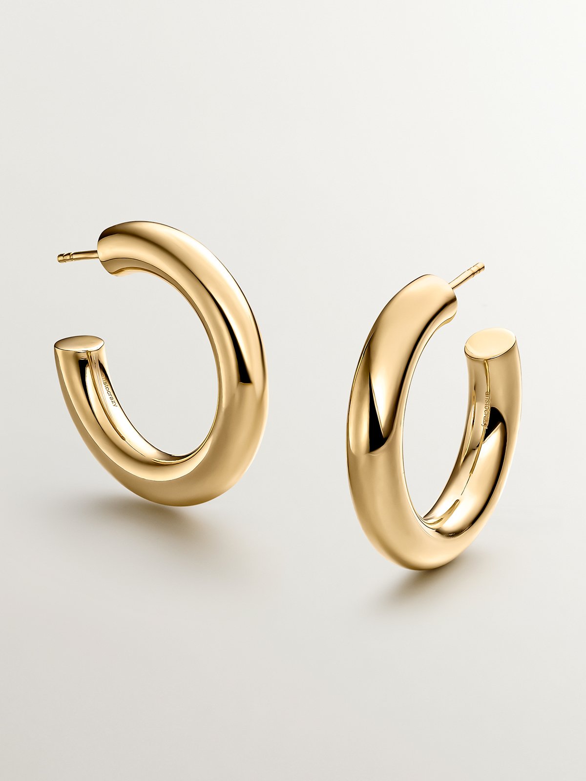Thick hoop earrings made of 925 silver plated in 18K yellow gold