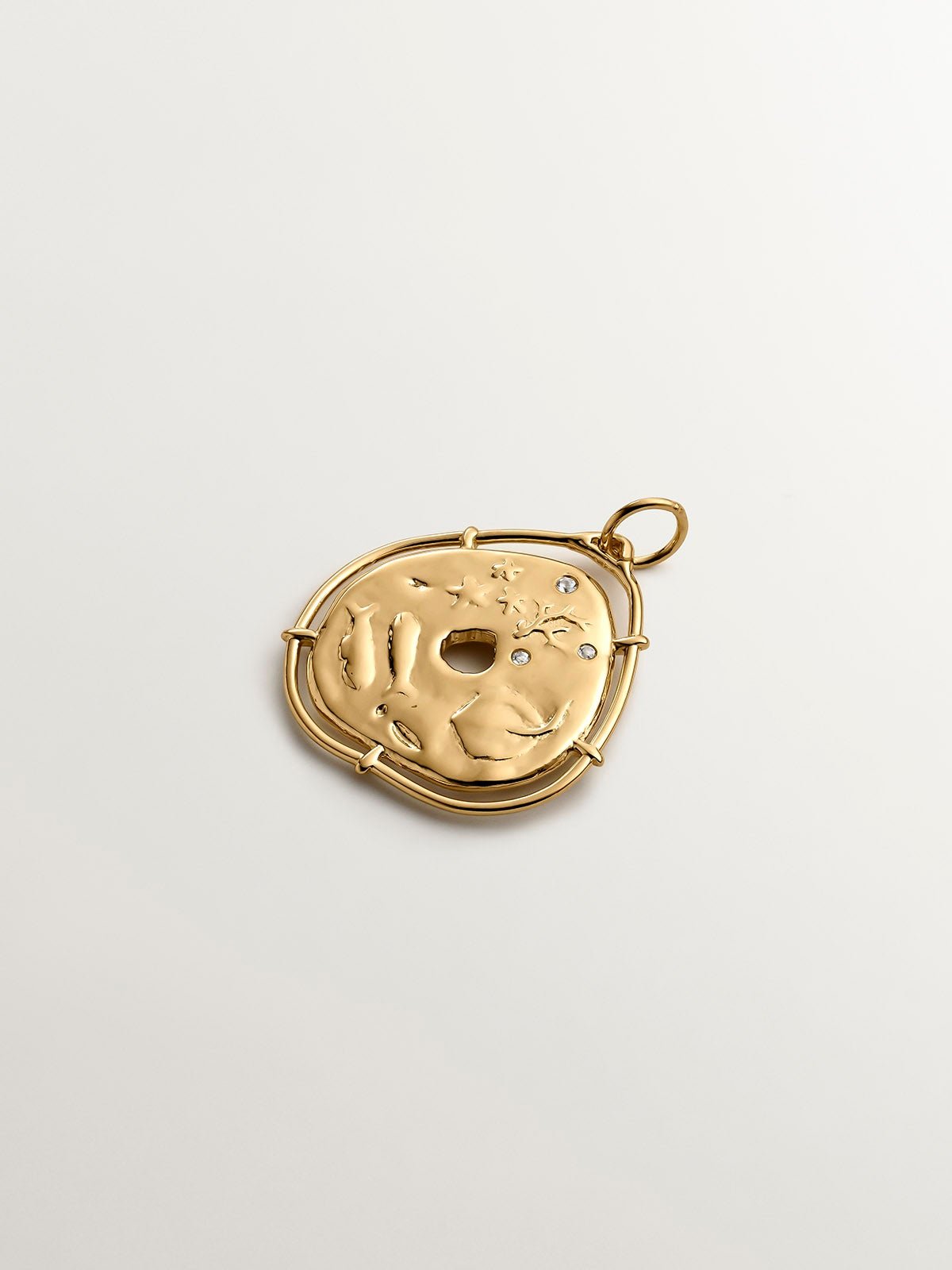 925 Silver charm, gold-plated in 18K yellow gold, with an irregular medallion shape and white topaz stones.